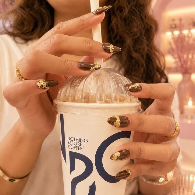 Chocolate and gold chrome almond nails by The Nail Aura
