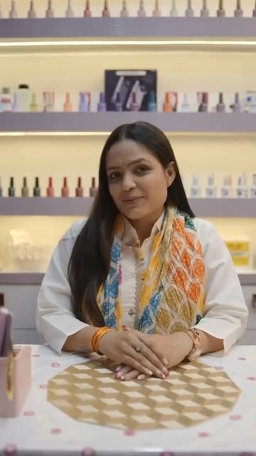 Jaya Yaduwanshi, nail technician and founder, at her studio desk